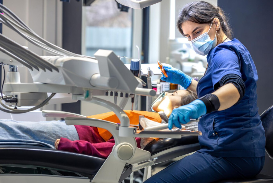 Dentist performing Emergency Dentistry